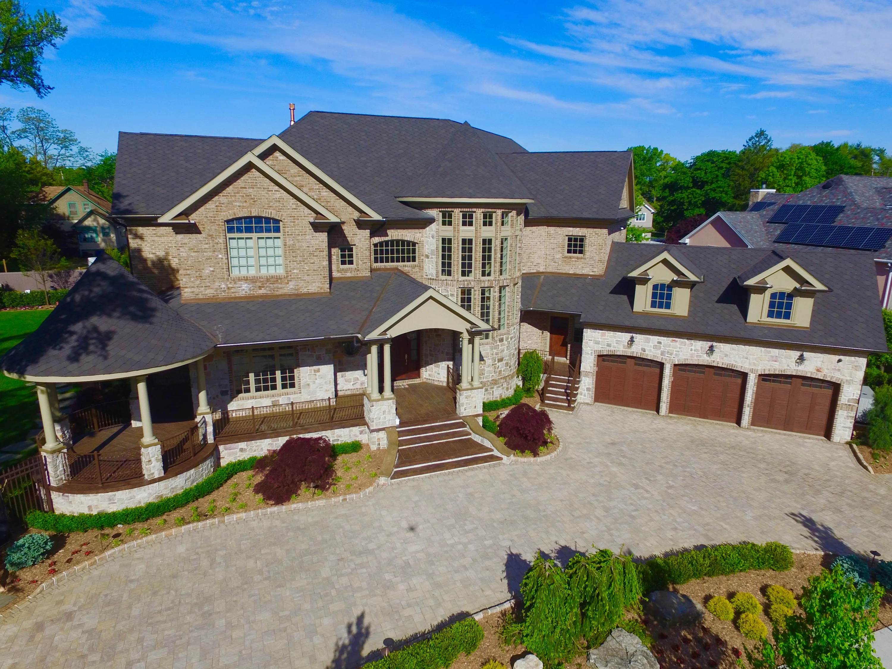 Aerial view of a residence and landscaped motor court in New York.