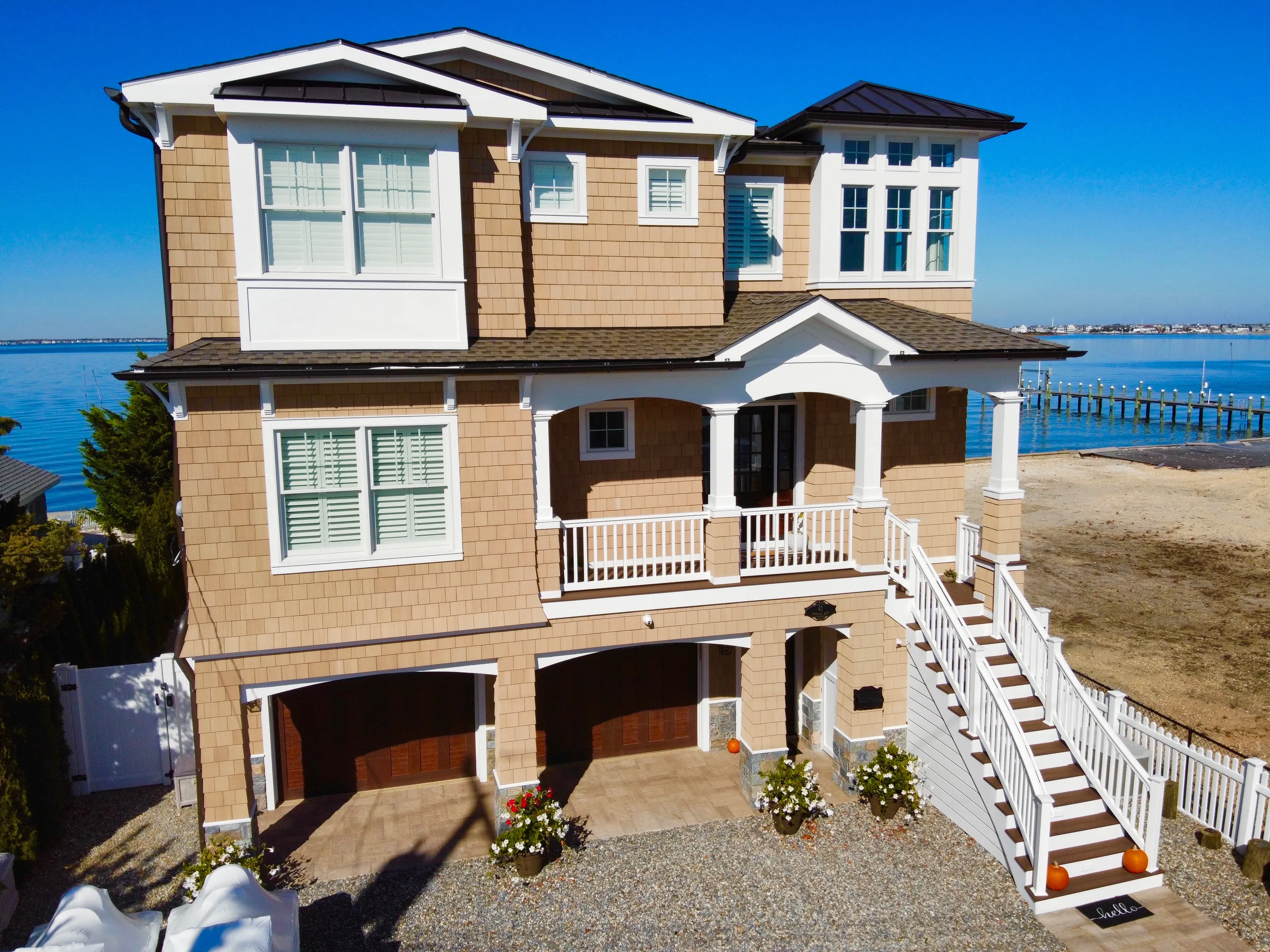 Bayfront residence with an elevated entry and broad water views in New Jersey.