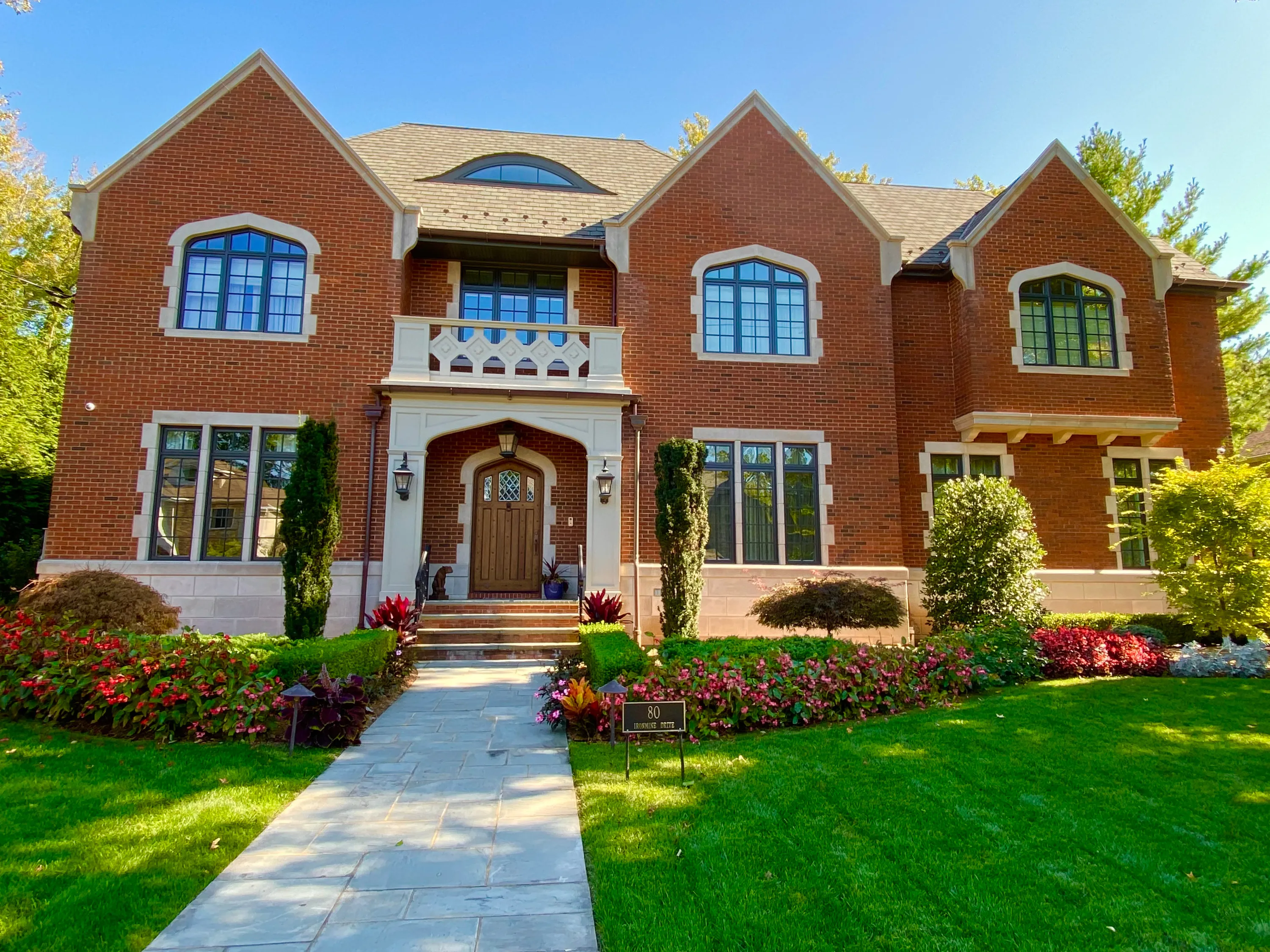 Brick residence with a symmetrical front elevation in New York.