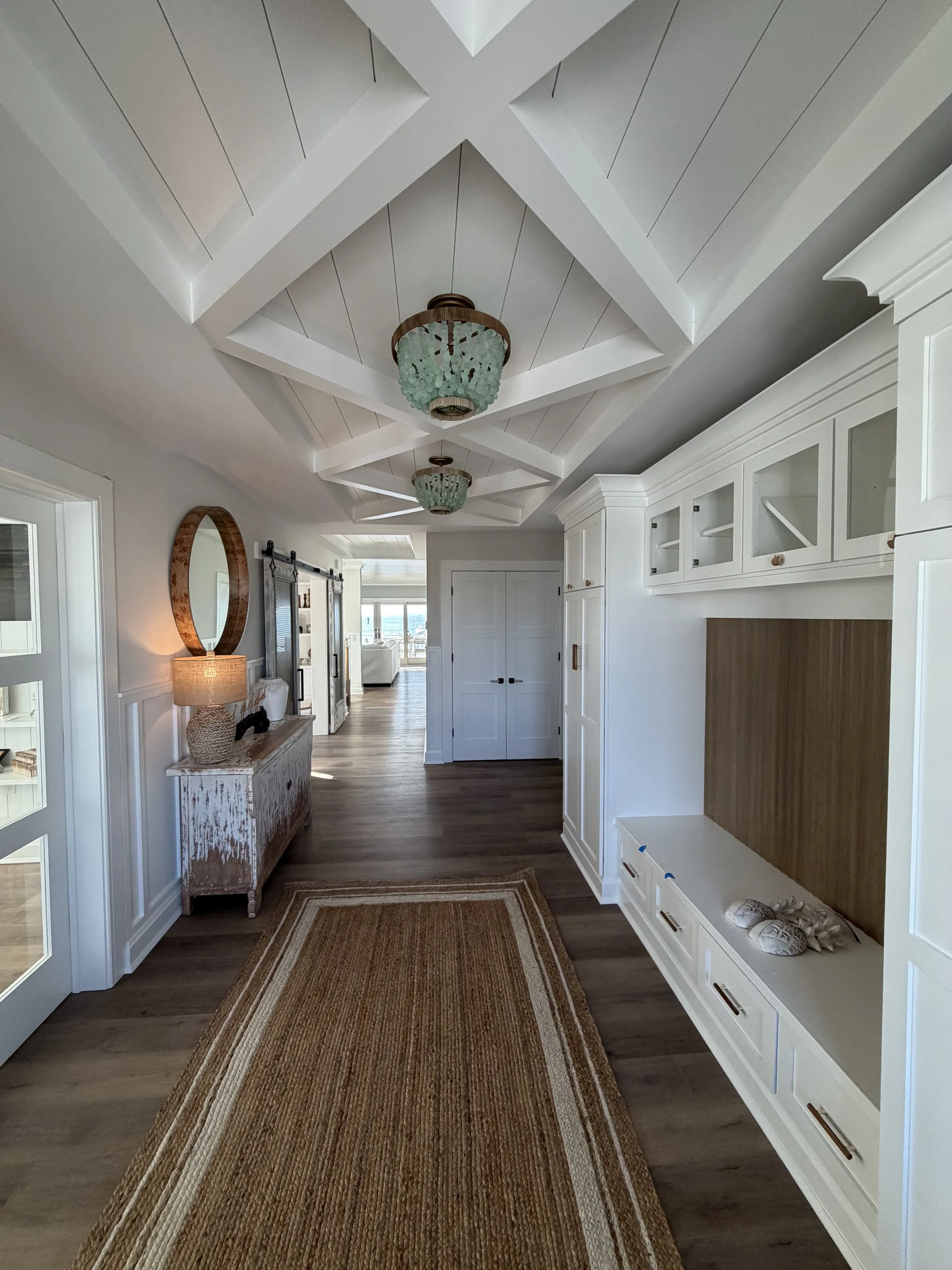 Bedroom dressing area with built-in cabinetry and a detailed ceiling.